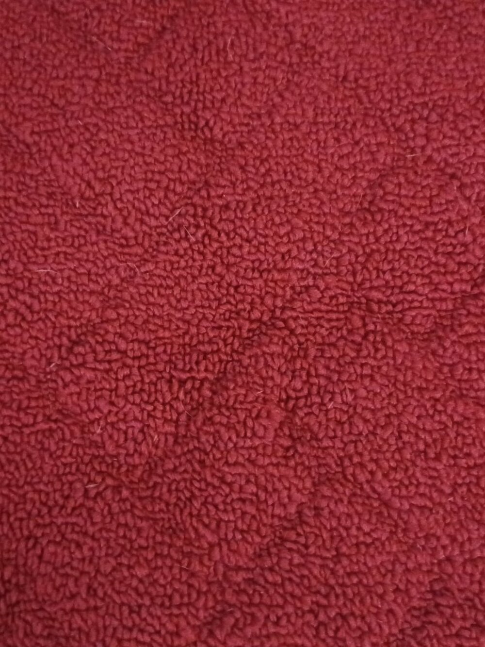The product is a 45x28 red area rug, which is an original piece.